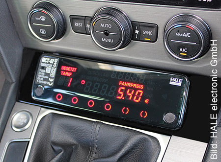 Ein eingebautes Taxameter. Links darauf steht 'Besetzt', 'Tarif 1' und Fahrpreis 5,40 Euro