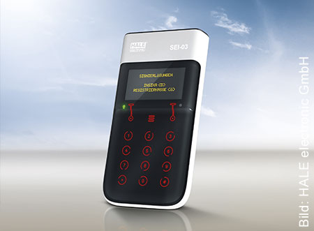 Eine TSE-Lösung mit weißem Gehäuse. Die Bedienknöpfe sind rot und das Display hat gelbe Schrift